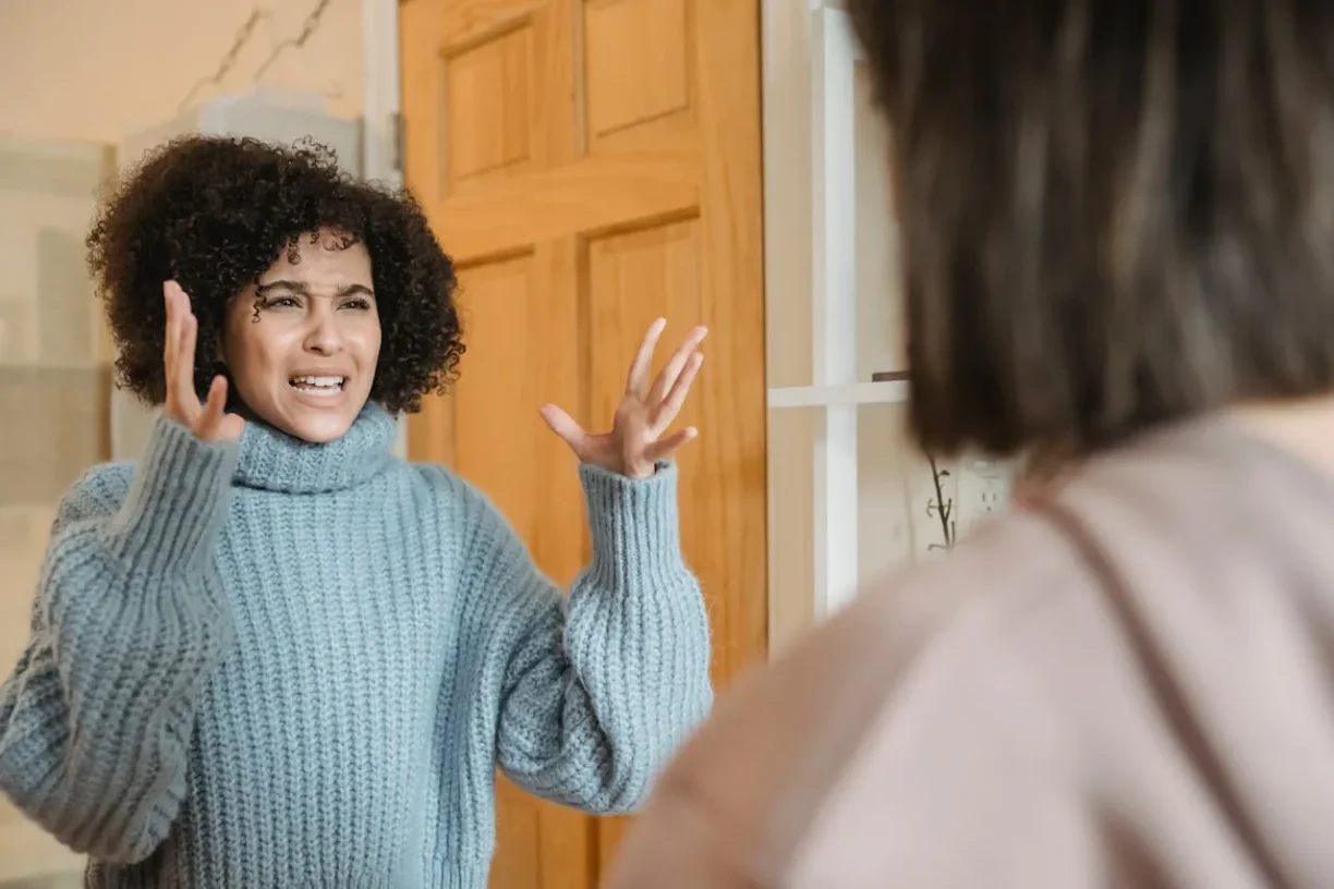 Distressed woman arguing during a personal dispute, representing emotional distress and civil conflict issues.