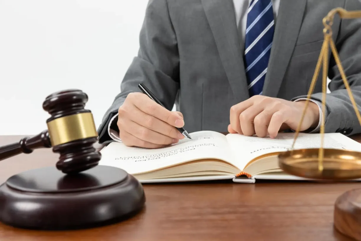 Personal injury lawyer reviewing legal documents to help victims of slip and fall accidents seek compensation.